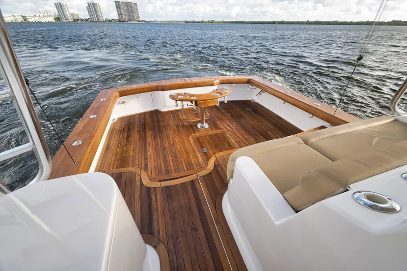 Magadi Yacht Photos Pics 2015 Ritchie Howell Express boat with teak deck, cruising on open water.