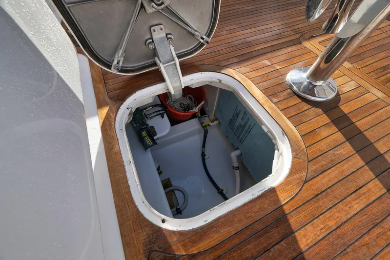 Magadi Yacht Photos Pics Hatch opening on 2015 Ritchie Howell Express boat deck, revealing storage compartment.