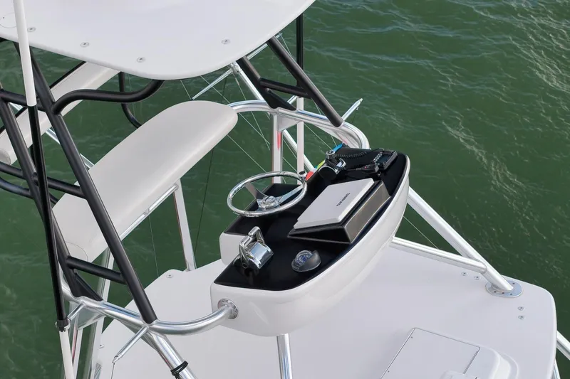 Magadi Yacht Photos Pics 2015 Ritchie Howell Express boat helm station with steering wheel and controls.