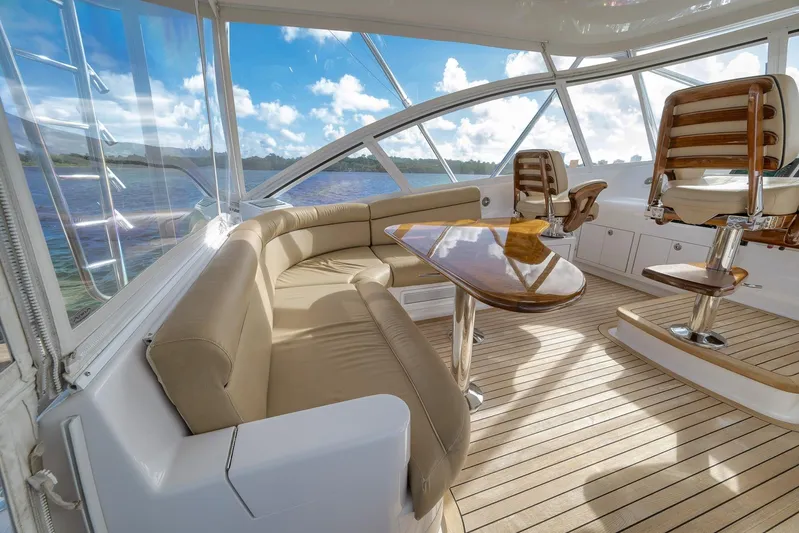 Magadi Yacht Photos Pics Luxurious 2015 Ritchie Howell Express yacht interior with leather seating and wooden accents.