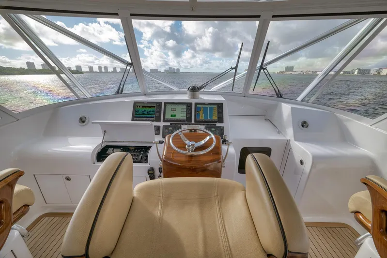 Magadi Yacht Photos Pics Helm of 2015 Ritchie Howell Express yacht with navigation screens and ocean view.