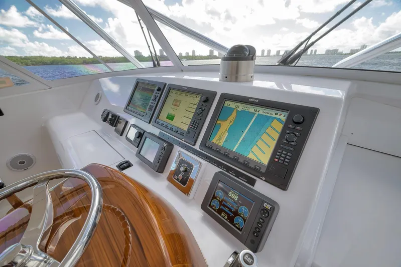 Magadi Yacht Photos Pics Helm of 2015 Ritchie Howell Express yacht with navigation screens and controls.