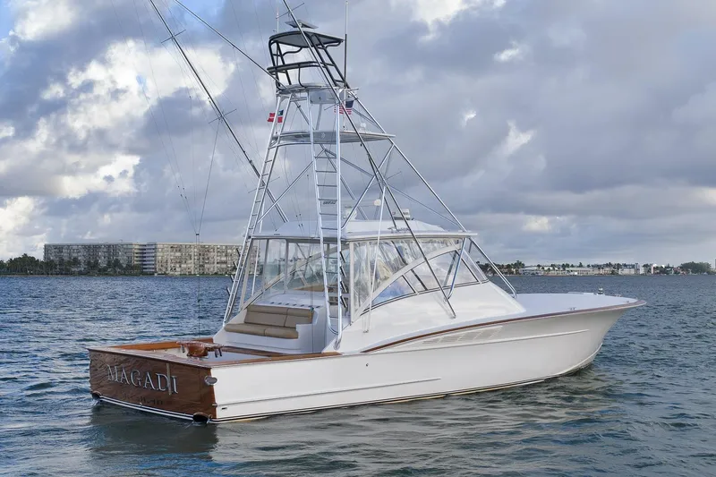 Magadi Yacht Photos Pics 2015 Ritchie Howell Express yacht on water under cloudy sky.