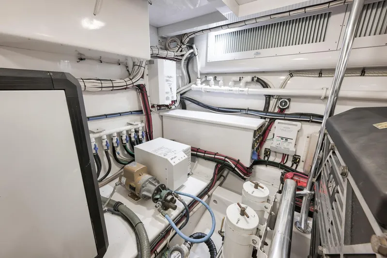 Magadi Yacht Photos Pics Engine room of 2015 Ritchie Howell Express boat, showcasing wiring and machinery.
