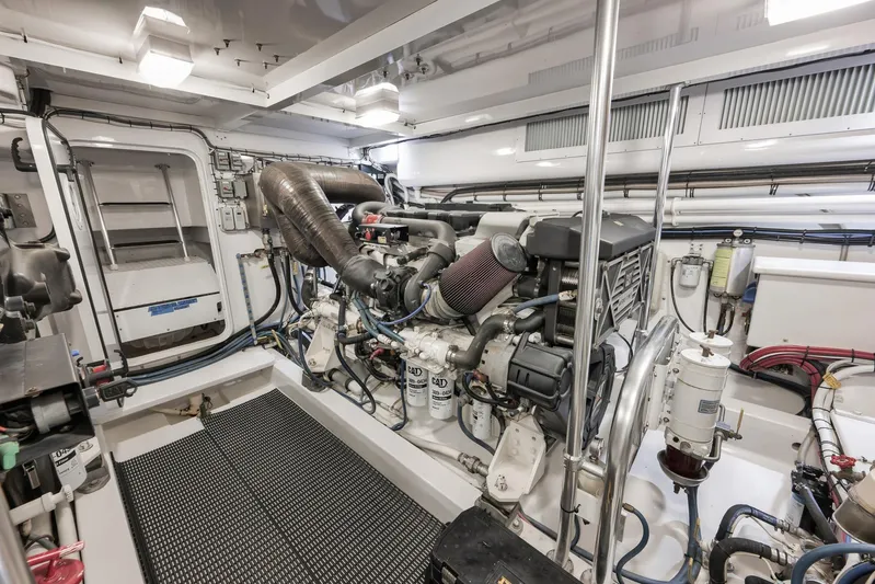 Magadi Yacht Photos Pics Engine room of 2015 Ritchie Howell Express boat, showcasing detailed mechanical components.