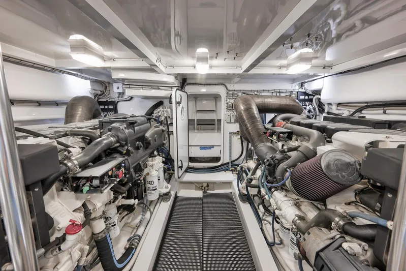 Magadi Yacht Photos Pics Engine room of 2015 Ritchie Howell Express boat, featuring dual engines and clean layout.