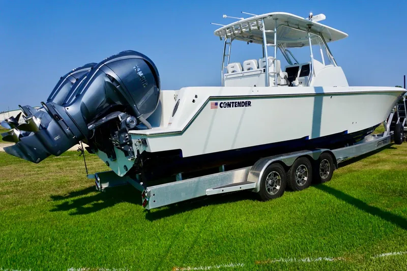  Yacht Photos Pics 2022 Contender 39 Fisharound boat on trailer, featuring powerful outboard engines.