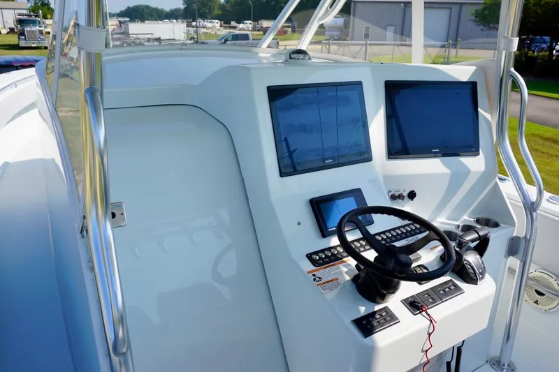  Yacht Photos Pics 2022 Contender 39 Fisharound boat dashboard with modern navigation screens and controls.