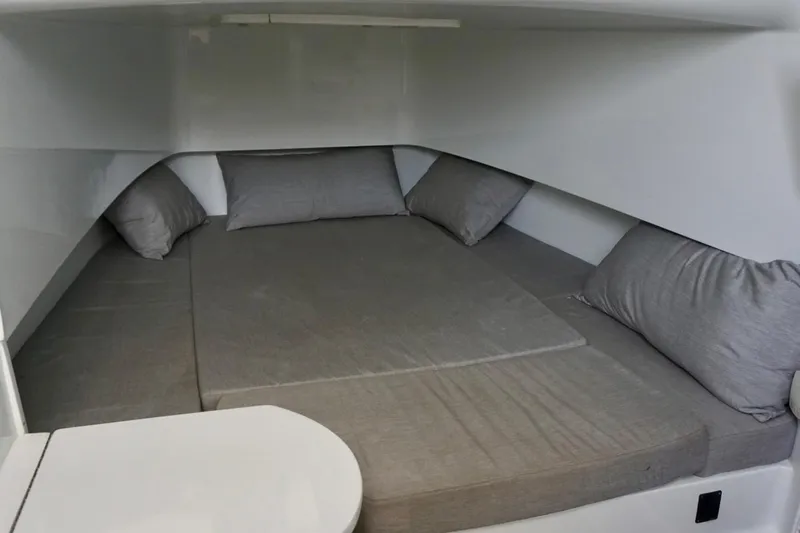  Yacht Photos Pics 2022 Contender 39 Fisharound cabin with cozy gray bedding and pillows.