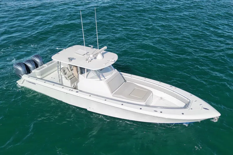  Yacht Photos Pics 2022 Contender 39 Fisharound boat on open water, featuring dual outboard motors.