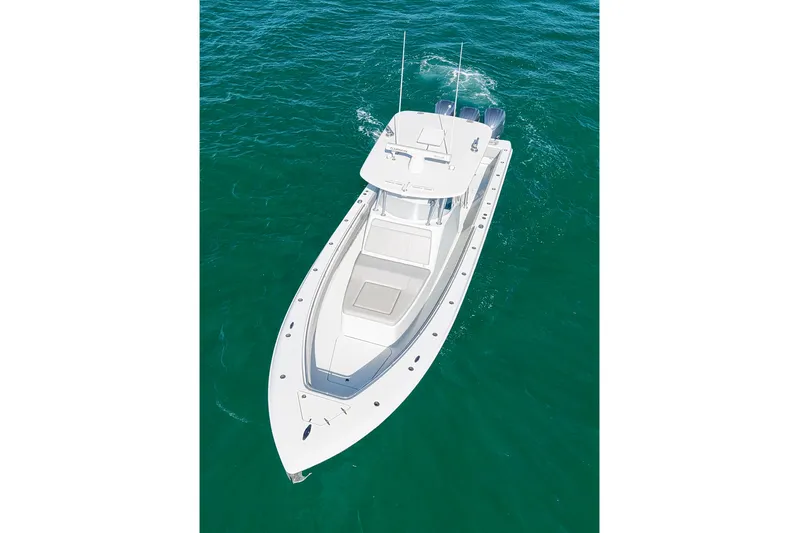  Yacht Photos Pics 2022 Contender 39 Fisharound boat cruising on clear blue water.