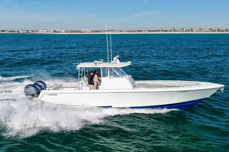  Yacht Photos Pics 2022 Contender 39 Fisharound boat cruising on open water, featuring twin engines.