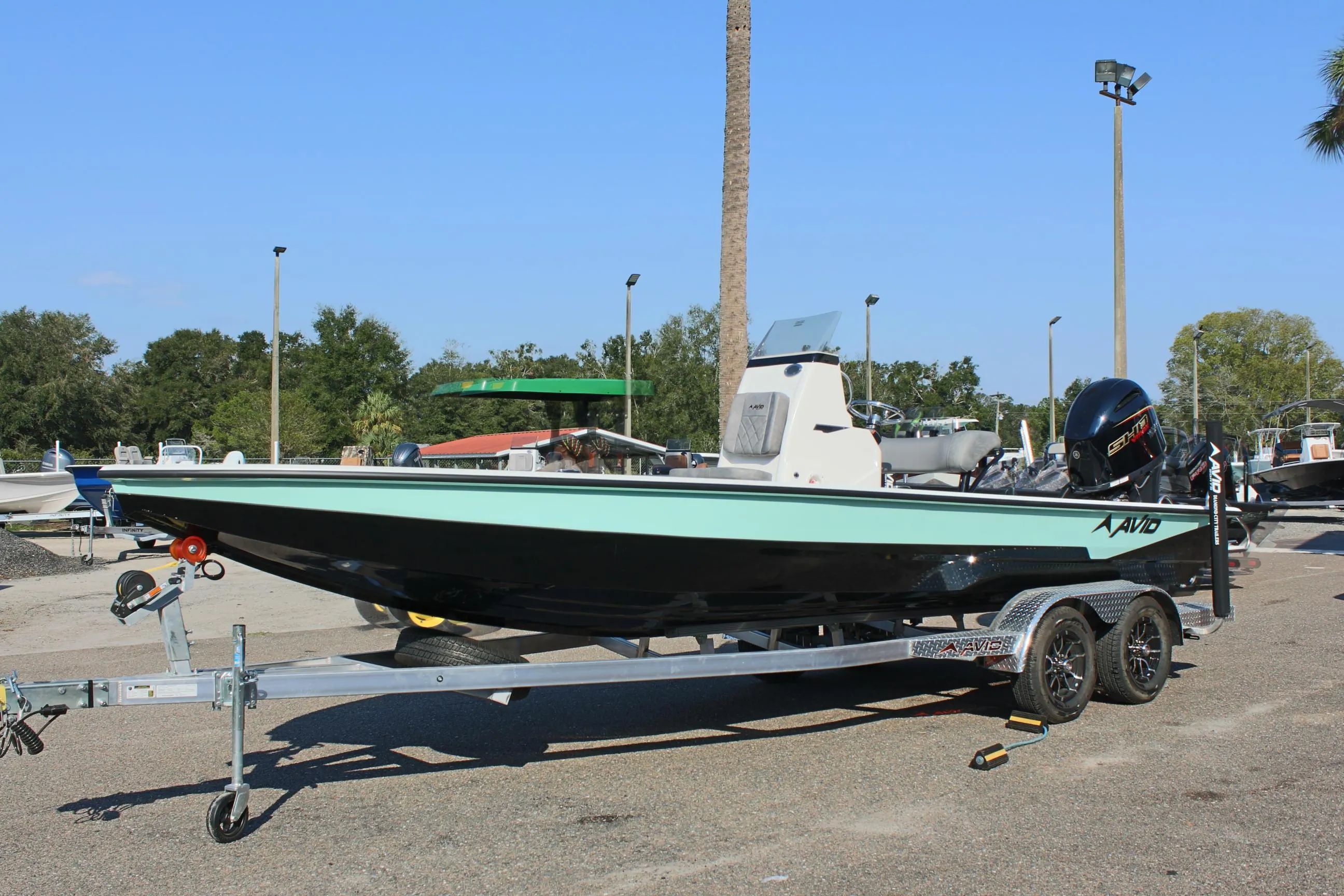 2025 Avid 23 FSX boat on trailer in outdoor setting.