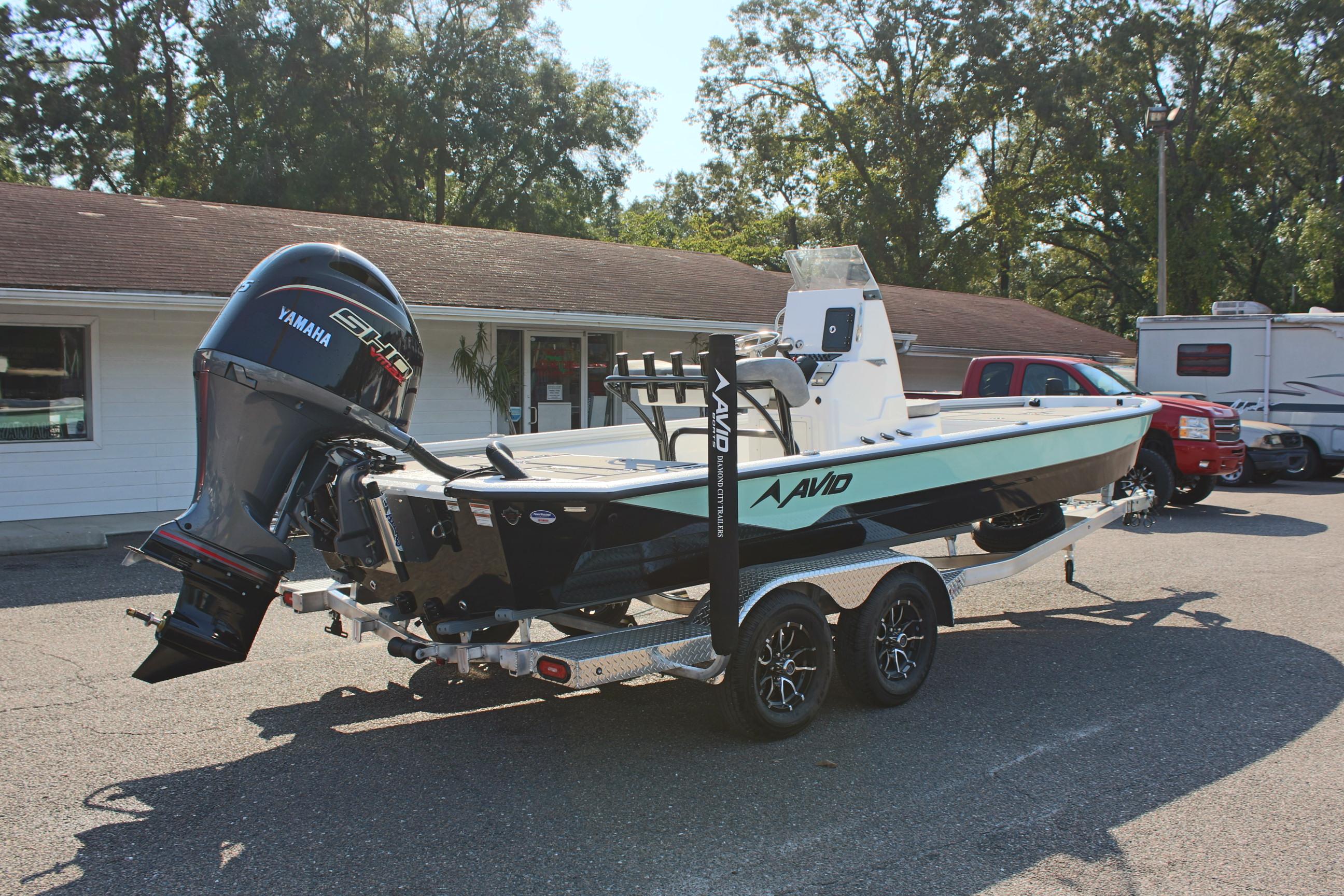 2025 Avid 23 FSX boat on trailer with Yamaha outboard motor.