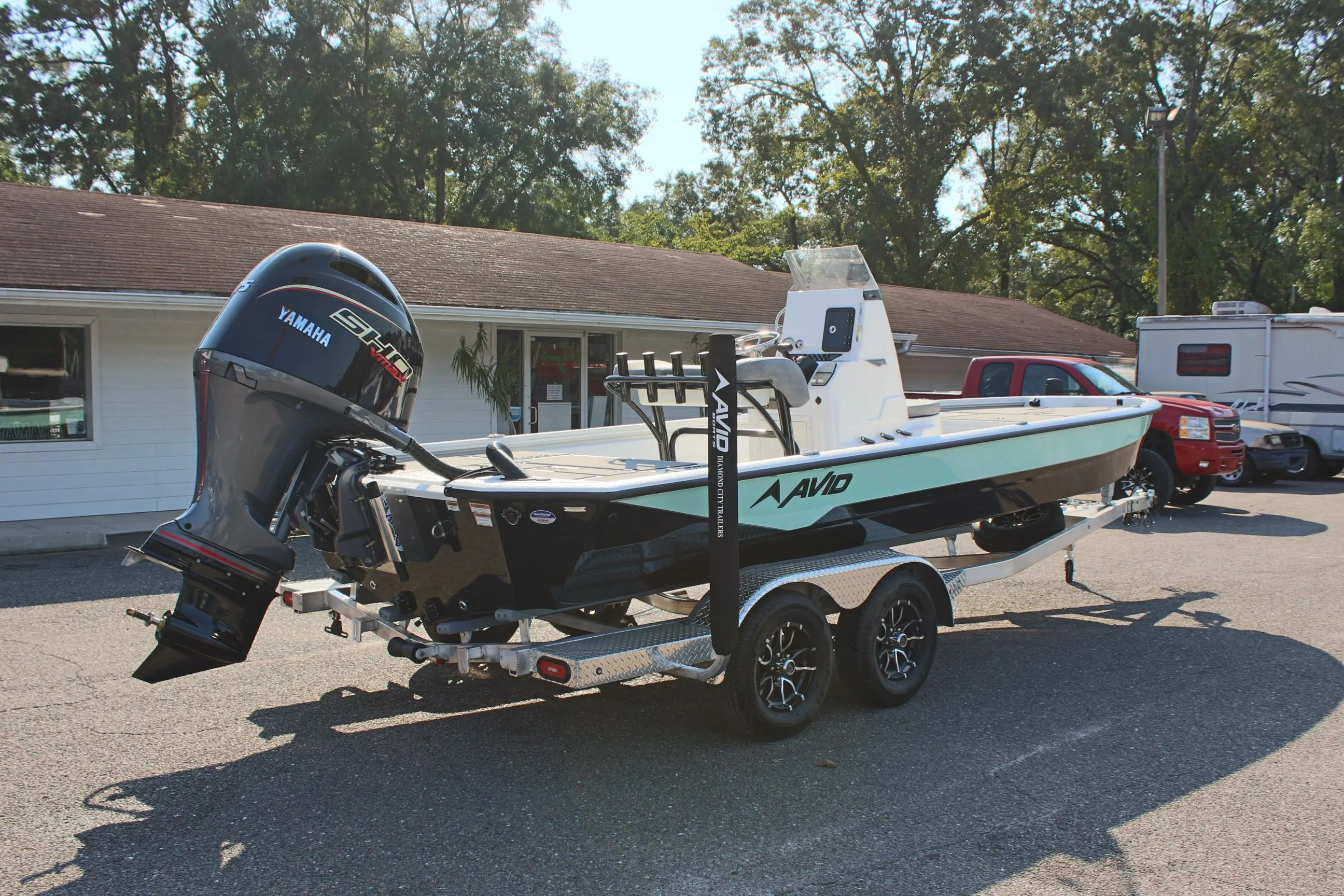 2025 Avid 23 FSX boat on trailer with Yamaha outboard motor.