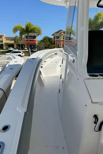 37-039 Yacht Photos Pics 2025 Regulator 37 boat deck with modern design and coastal background.