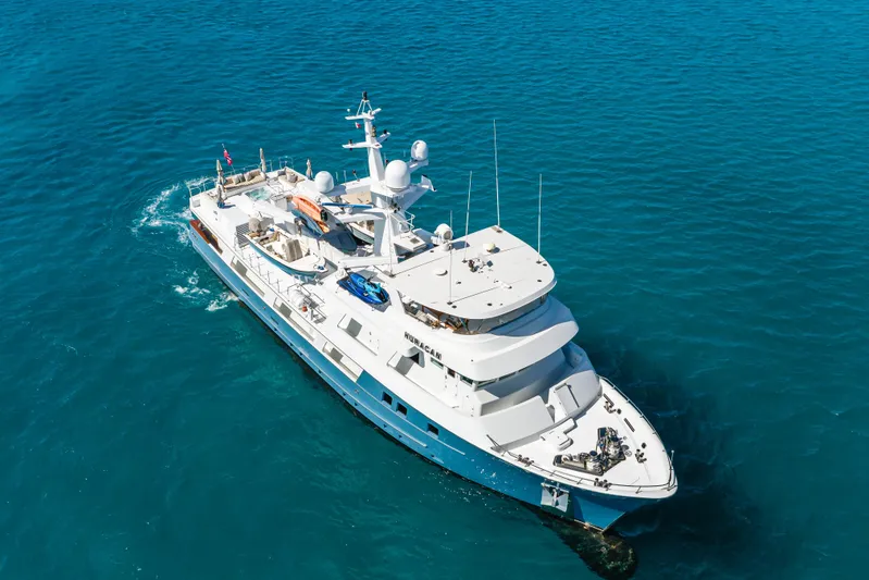 Huracan Yacht Photos Pics Aerial view of 1991 Delta Marine Expedition yacht on blue ocean waters.
