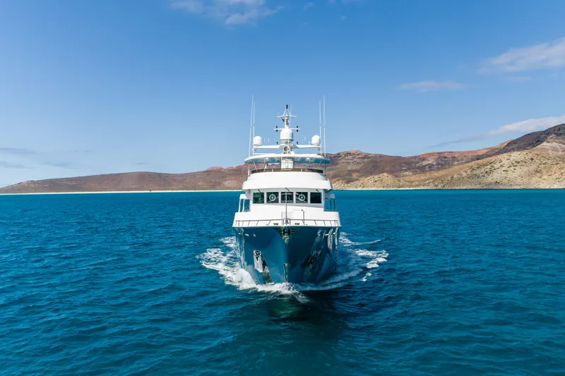 Huracan Yacht Photos Pics Delta Marine Expedition yacht cruising in clear blue waters, 1991 model.