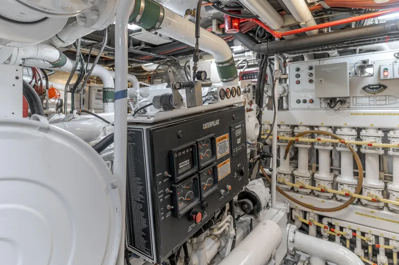 Huracan Yacht Photos Pics Engine room of 1991 Delta Marine Expedition yacht with complex machinery and control panels.