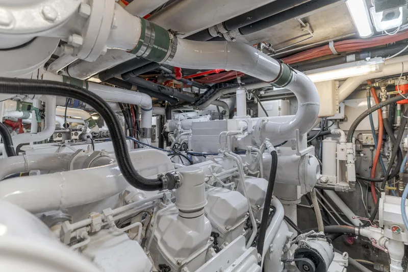 Huracan Yacht Photos Pics Engine room of 1991 Delta Marine Expedition yacht, showcasing complex machinery and piping.