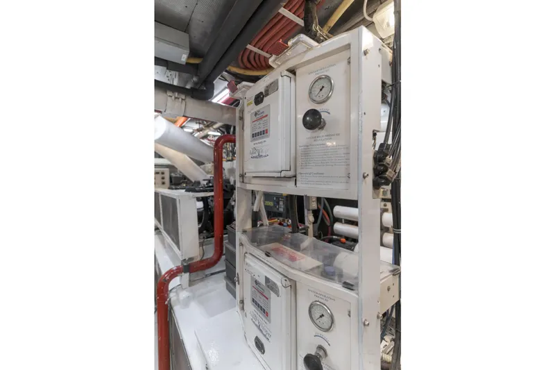 Huracan Yacht Photos Pics Engine room of 1991 Delta Marine Expedition yacht with control panels and gauges.