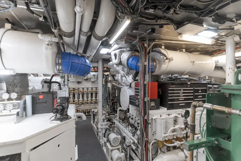 Huracan Yacht Photos Pics Engine room of 1991 Delta Marine Expedition yacht, featuring complex machinery and piping systems.