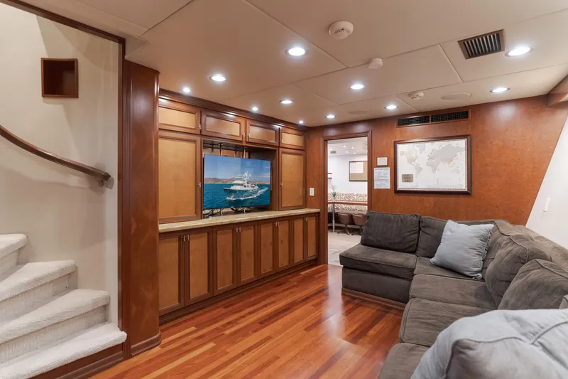 Huracan Yacht Photos Pics Luxurious interior of 1991 Delta Marine Expedition yacht with wood paneling and cozy seating.