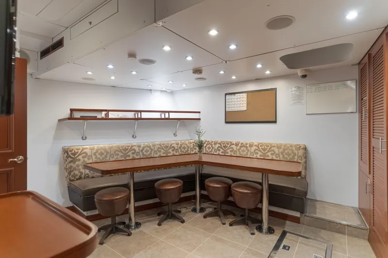 Huracan Yacht Photos Pics Luxurious interior of 1991 Delta Marine Expedition yacht with elegant seating and modern lighting.