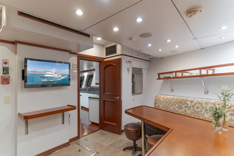 Huracan Yacht Photos Pics Luxurious interior of 1991 Delta Marine Expedition yacht with elegant seating and modern amenities.