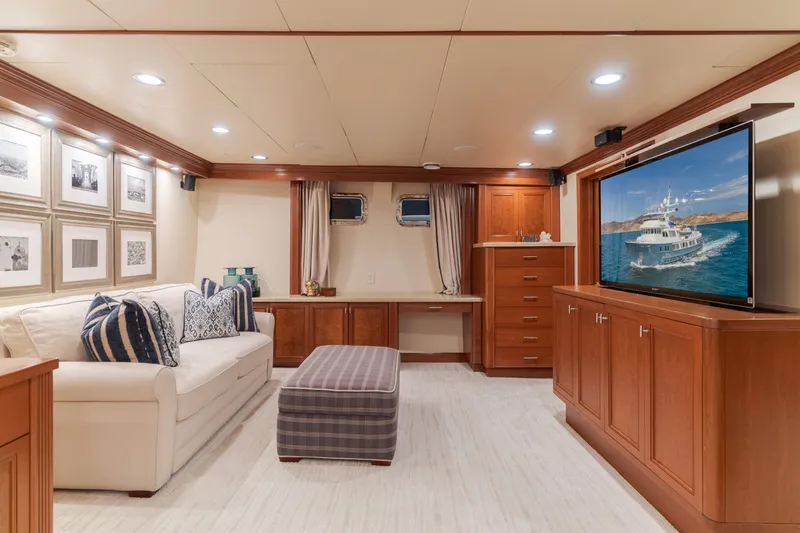 Huracan Yacht Photos Pics Luxurious 1991 Delta Marine Expedition yacht interior with elegant wood cabinetry and cozy seating area.