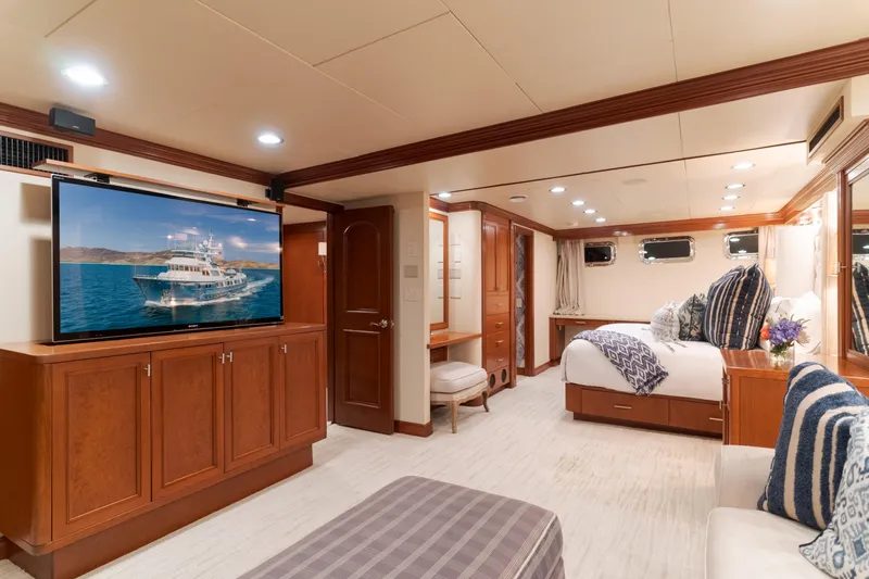 Huracan Yacht Photos Pics Luxurious 1991 Delta Marine Expedition yacht interior with elegant bedroom and entertainment area.