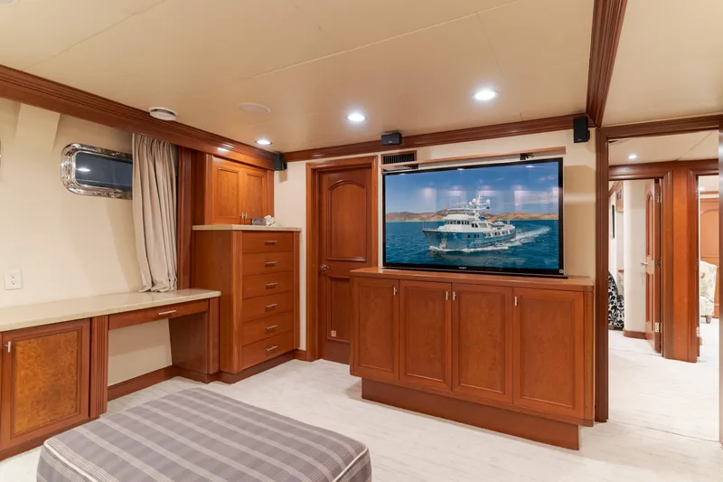 Huracan Yacht Photos Pics Luxurious interior of 1991 Delta Marine Expedition yacht with wood cabinetry and large TV.