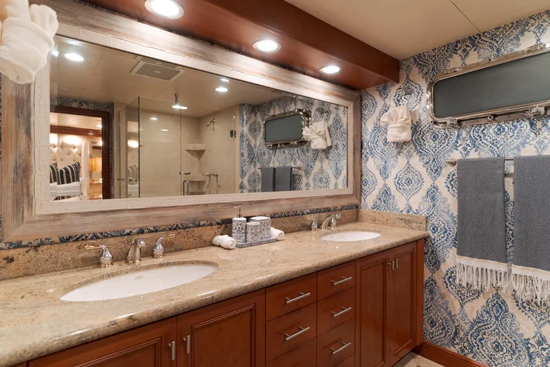 Huracan Yacht Photos Pics Luxurious bathroom in 1991 Delta Marine Expedition yacht with double sinks and elegant decor.