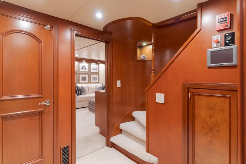 Huracan Yacht Photos Pics Luxurious interior of 1991 Delta Marine Expedition yacht with wooden finishes and elegant staircase.