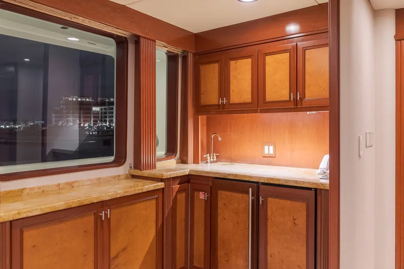 Huracan Yacht Photos Pics Luxurious wooden interior of 1991 Delta Marine Expedition yacht with elegant cabinetry and countertops.