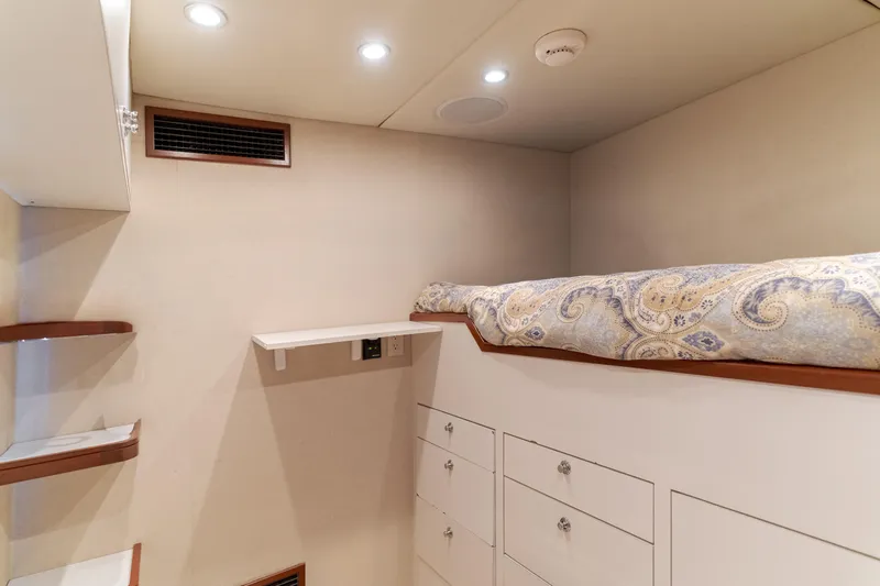 Huracan Yacht Photos Pics Cozy cabin interior of 1991 Delta Marine Expedition yacht with built-in storage and bed.