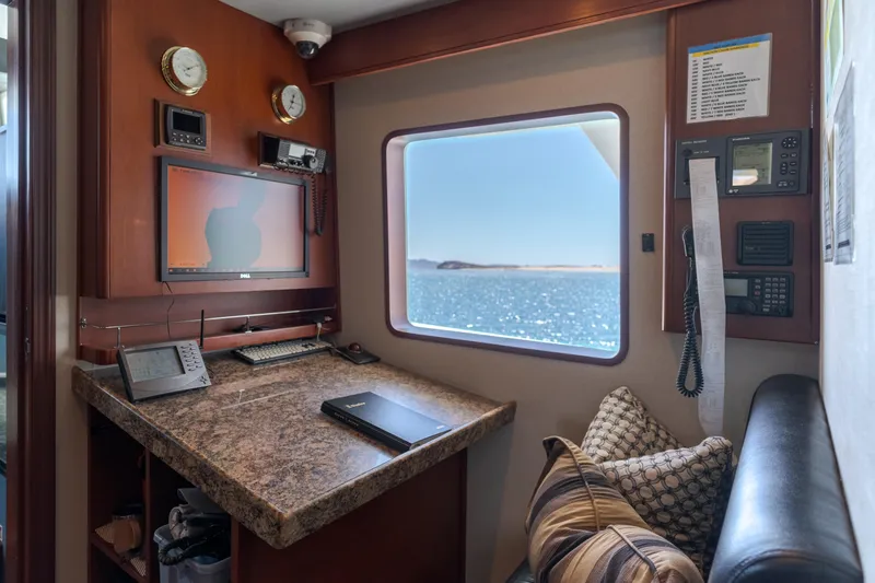 Huracan Yacht Photos Pics Cozy Delta Marine Expedition 1991 yacht interior with navigation equipment and ocean view.