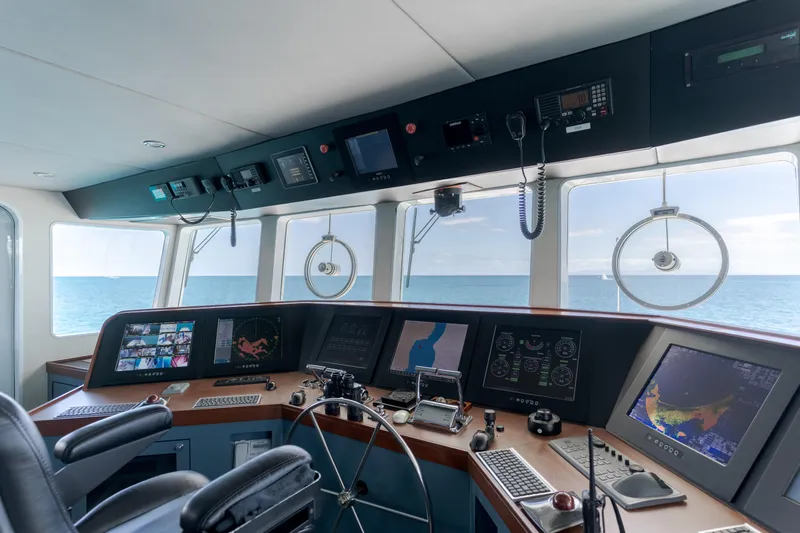 Huracan Yacht Photos Pics Bridge of 1991 Delta Marine Expedition yacht with navigation equipment and ocean view.