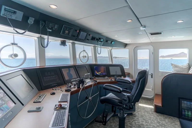 Huracan Yacht Photos Pics Bridge of 1991 Delta Marine Expedition yacht with modern navigation equipment and ocean view.