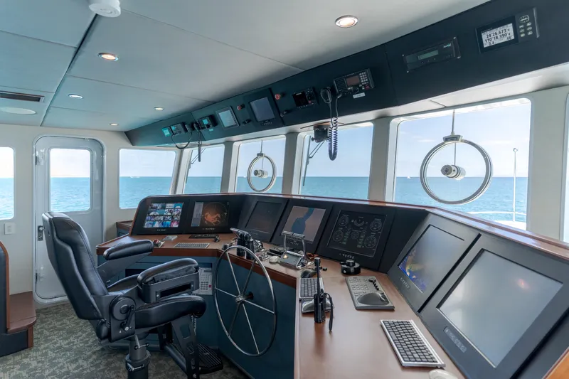 Huracan Yacht Photos Pics Bridge of 1991 Delta Marine Expedition yacht with modern navigation equipment and ocean view.