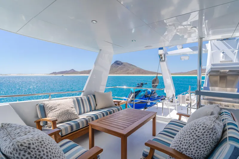 Huracan Yacht Photos Pics Luxurious 1991 Delta Marine Expedition yacht deck with ocean view and comfortable seating.