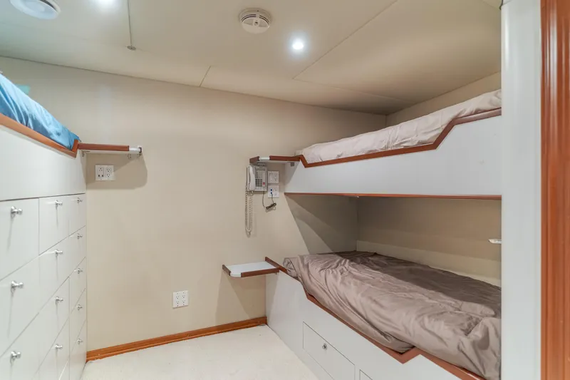 Huracan Yacht Photos Pics Bunk beds in a 1991 Delta Marine Expedition yacht cabin with storage drawers.