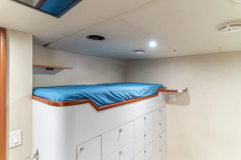 Huracan Yacht Photos Pics Cozy cabin bed with storage in 1991 Delta Marine Expedition yacht.