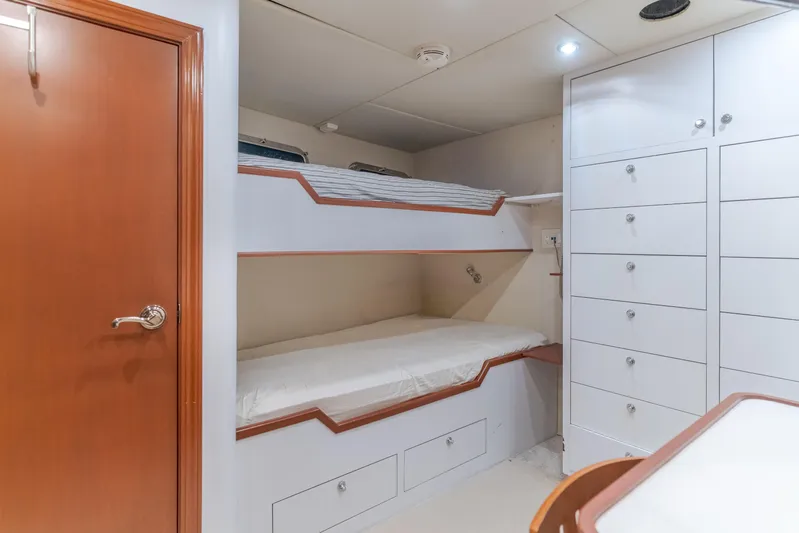 Huracan Yacht Photos Pics Bunk beds and storage in 1991 Delta Marine Expedition yacht cabin interior.
