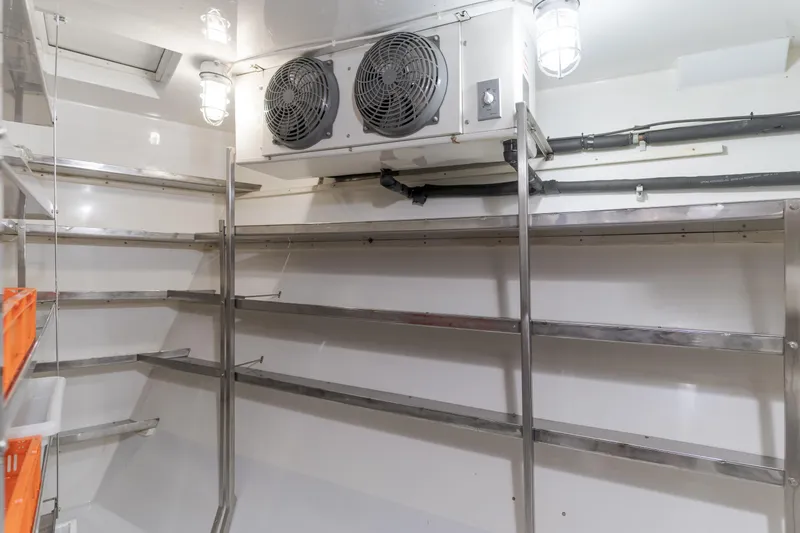 Huracan Yacht Photos Pics Stainless steel shelving in a 1991 Delta Marine Expedition yacht storage room.