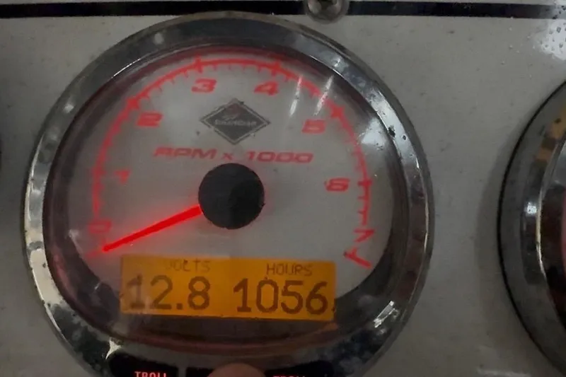  Yacht Photos Pics Close-up of 2007 Fountain 33 Sportfish Cruiser tachometer showing 12.8 volts and 1056 hours.