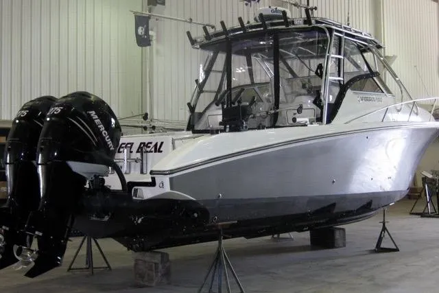  Yacht Photos Pics 2007 Fountain 33 Sportfish Cruiser in a garage with dual Mercury outboard engines.