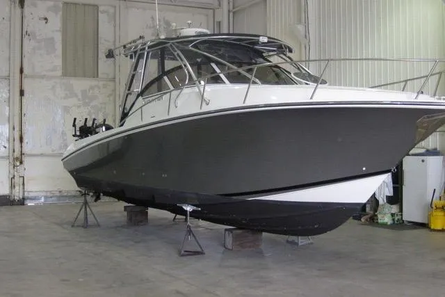  Yacht Photos Pics 2007 Fountain 33 Sportfish Cruiser in storage, showcasing sleek design and sturdy build.