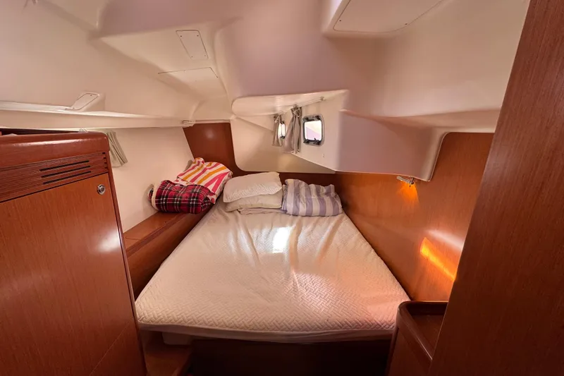 Wakadui Yacht Photos Pics Cozy cabin interior of 2009 Benetea 49 yacht with comfortable bedding.