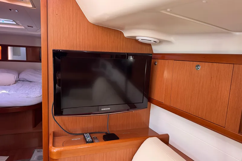 Wakadui Yacht Photos Pics Interior of 2009 Benetea 49 yacht with TV and cozy cabin.